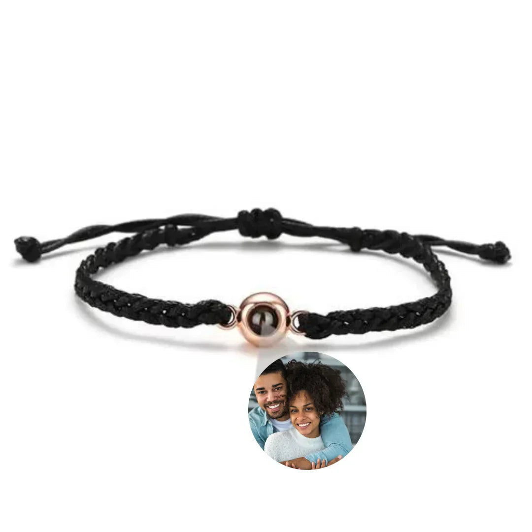 Black braided cord with rose gold tone stone, a custom photo bracelet showing a smiling couple inside